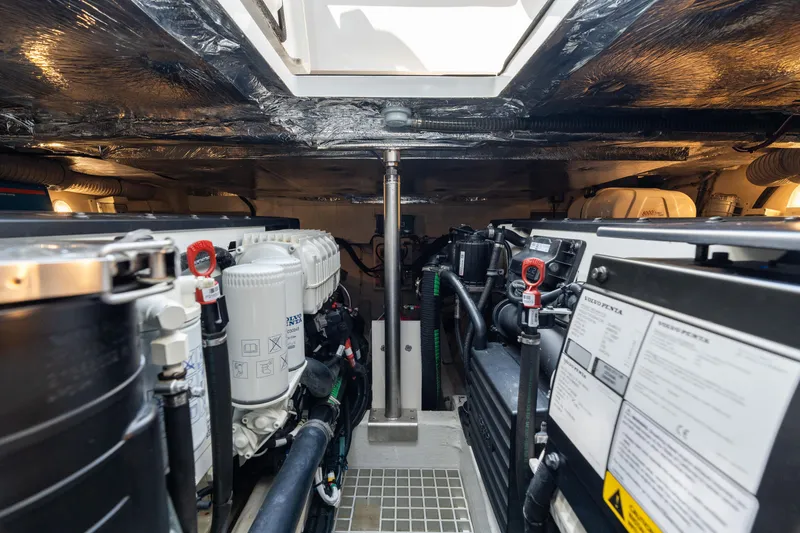 Slide: The Image of Engine room of 2022 Fjord 44 Open yacht, showcasing mechanical components and systems. - 44