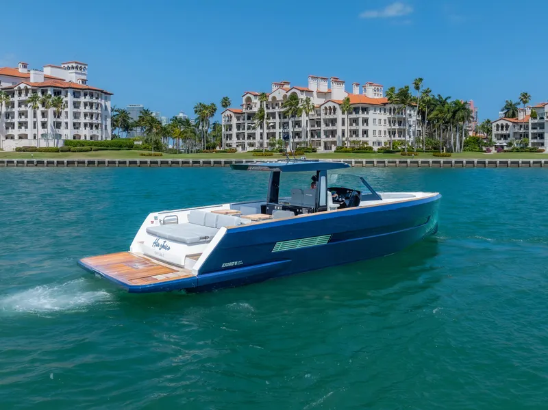 Slide: The Image of 2022 Fjord 44 Open yacht cruising near luxury waterfront residences. - 8