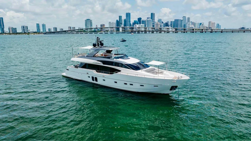 Slide: The Image of Luxurious 2022 Sanlorenzo SL86 yacht cruising near a city skyline on a sunny day. - 1