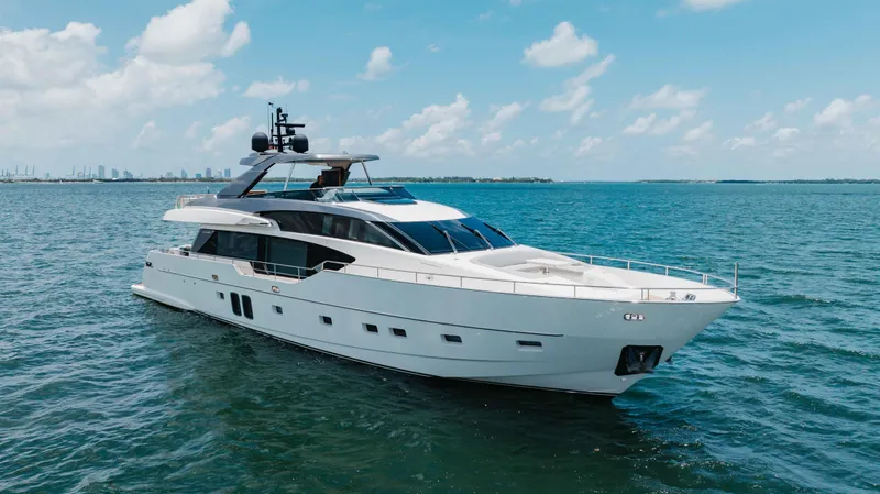 Slide: The Image of Luxurious 2022 Sanlorenzo SL86 yacht cruising on open water under a clear blue sky. - 11