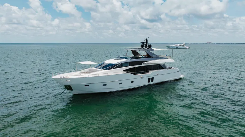 Slide: The Image of Sanlorenzo SL86 2022 yacht cruising on open sea under a partly cloudy sky. - 12