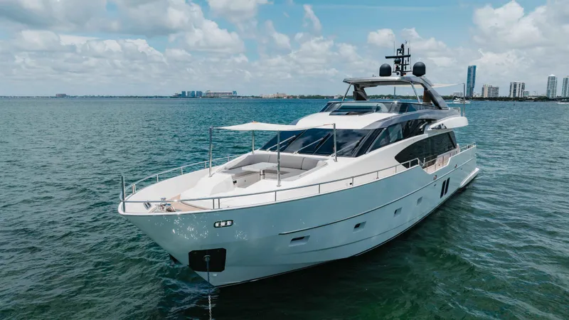 Slide: The Image of 2022 Sanlorenzo SL86 yacht cruising on open water under a partly cloudy sky. - 16