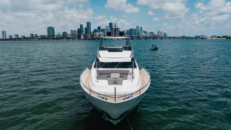 Slide: The Image of Sanlorenzo SL86 yacht on water with city skyline in background, 2022 model. - 18