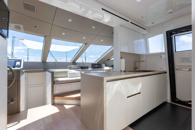 Slide: The Image of Luxurious interior of 2022 Sanlorenzo SL86 yacht with modern kitchen and seating area. - 39