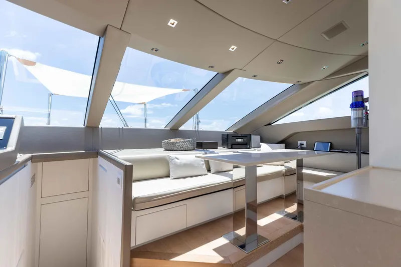 Slide: The Image of Luxurious interior of 2022 Sanlorenzo SL86 yacht with modern seating and panoramic windows. - 40