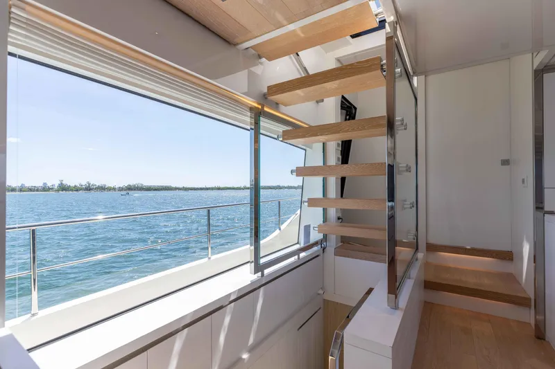 Slide: The Image of Interior of 2022 Sanlorenzo SL86 yacht with modern staircase and ocean view. - 43