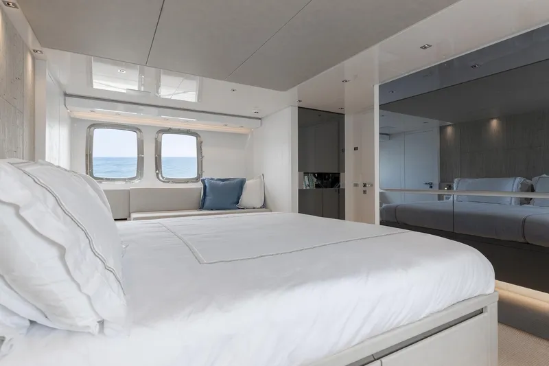 Slide: The Image of Luxurious Sanlorenzo SL86 2022 yacht bedroom with ocean view and modern decor. - 46
