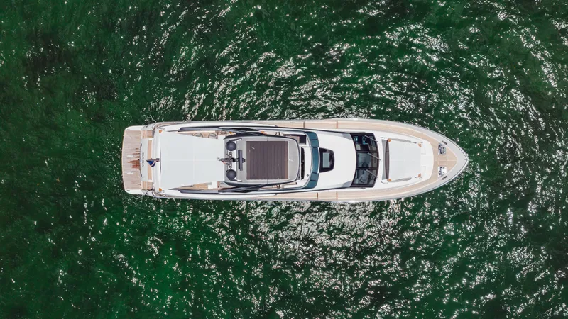 Slide: The Image of Aerial view of 2022 Sanlorenzo SL86 yacht on shimmering green water. - 5
