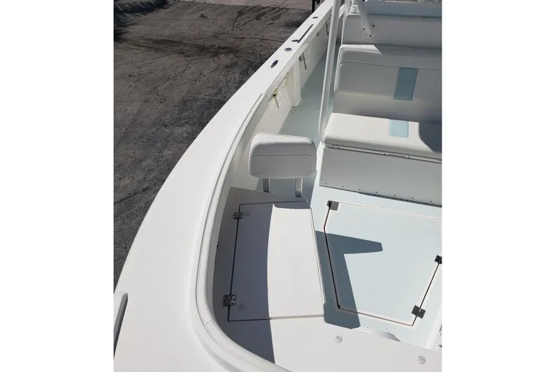 Slide: The Image of 2022 Albury Brothers 27 boat interior with seating and storage compartments. - 12