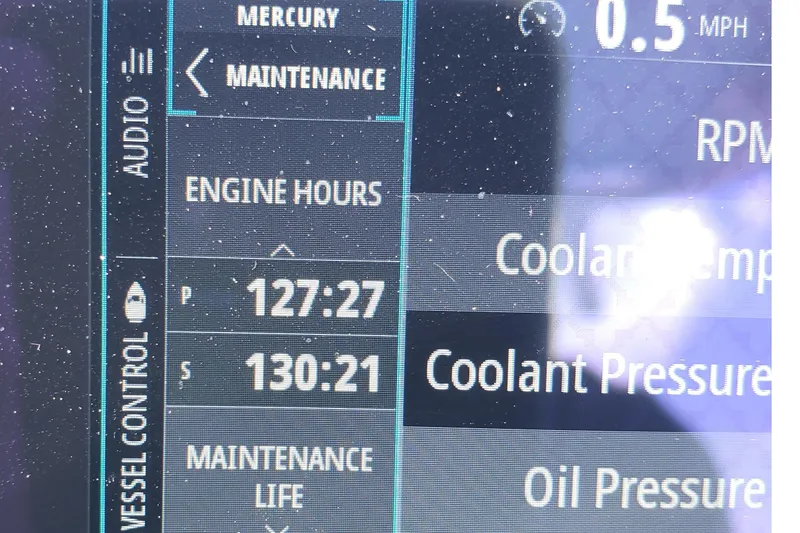 Slide: The Image of Close-up of Albury Brothers 27 boat's digital display showing engine hours and maintenance data. - 17