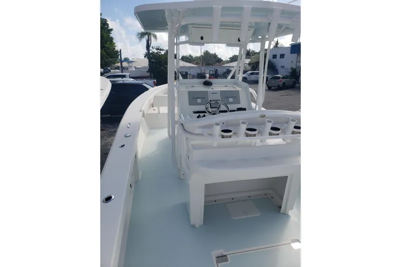 Slide: The Image of 2022 Albury Brothers 27 boat interior with helm and rod holders. - 18