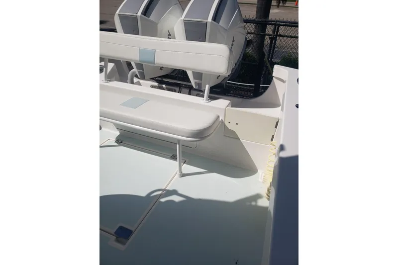 Slide: The Image of 2022 Albury Brothers 27 boat interior with seating and dual engines. - 23