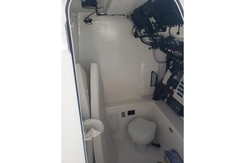 Slide: The Image of 2022 Albury Brothers 27 boat interior with toilet and electrical panel. - 24
