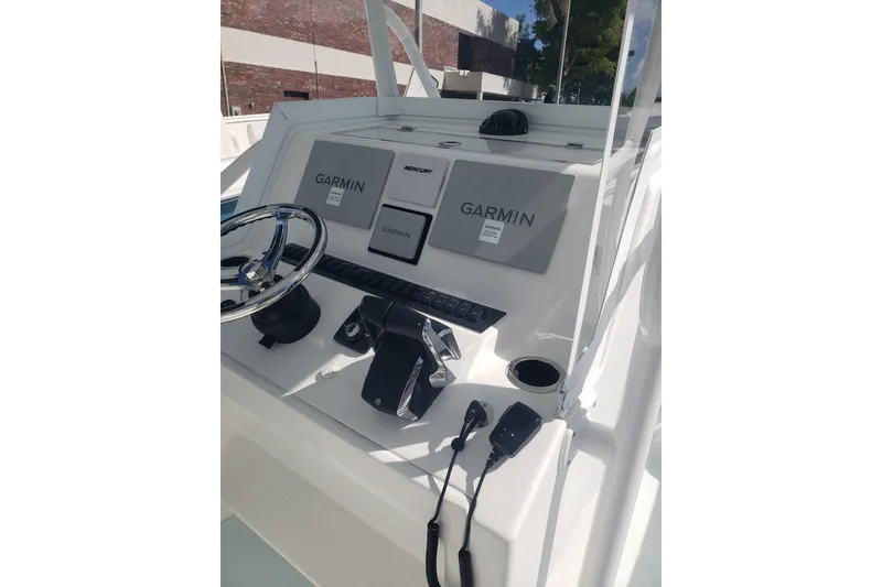 Slide: The Image of 2022 Albury Brothers 27 boat console with Garmin navigation and Mercury controls. - 26