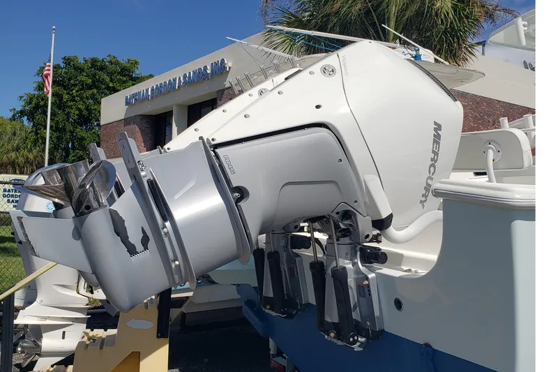 Slide: The Image of 2022 Albury Brothers 27 boat with Mercury outboard motor, displayed outdoors. - 6