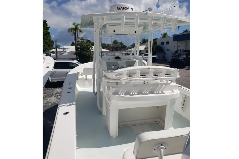 Slide: The Image of 2022 Albury Brothers 27 boat with Garmin equipment, docked under a clear sky. - 7