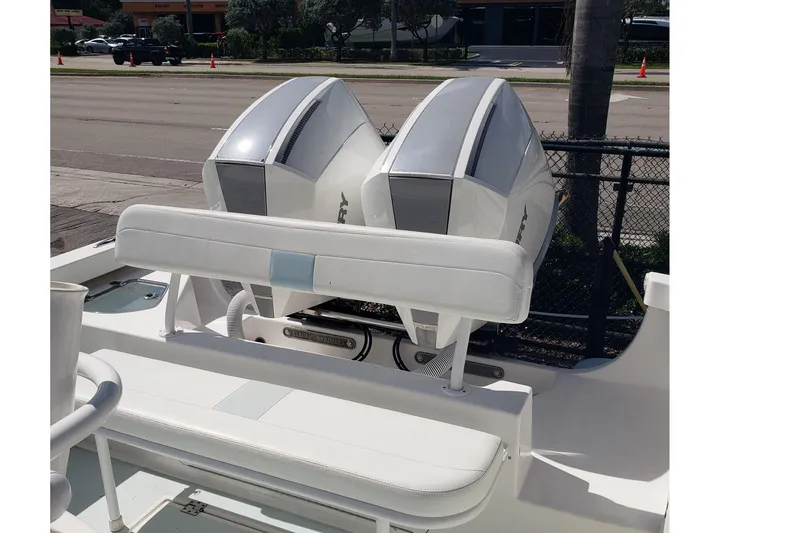 Slide: The Image of 2022 Albury Brothers 27 boat with dual outboard engines, parked near a street. - 9
