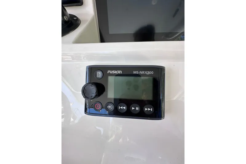 Slide: The Image of Fusion MS-NRX300 marine stereo on 2020 Intrepid 409 Valor boat dashboard. - 20