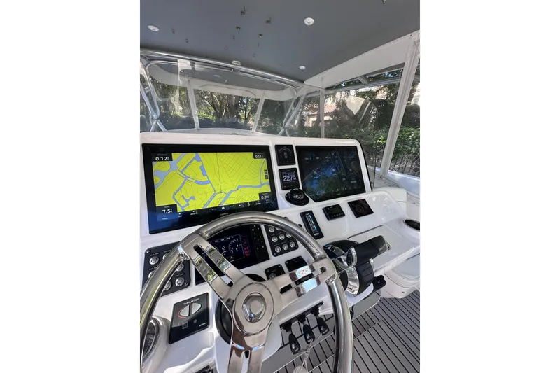 Slide: The Image of Cockpit of 2020 Intrepid 409 Valor with navigation screens and steering wheel. - 25