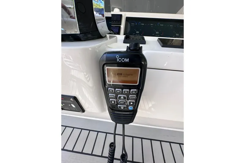 Slide: The Image of ICOM marine radio on 2020 Intrepid 409 Valor boat dashboard. - 27