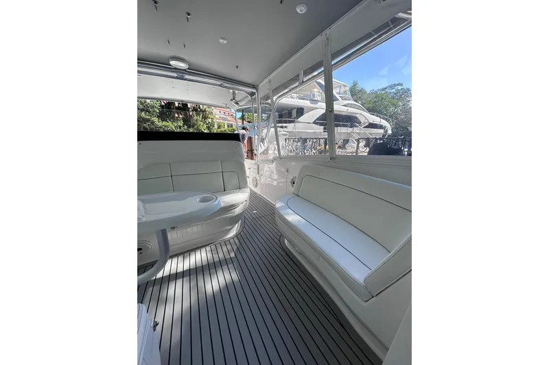 Slide: The Image of Interior of 2020 Intrepid 409 Valor boat with white seating and sleek design. - 36