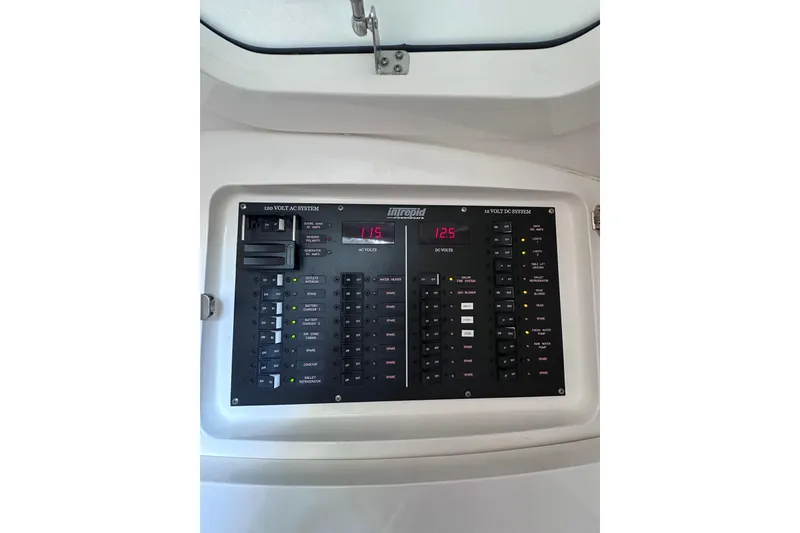 Slide: The Image of Intrepid 409 Valor 2020 electrical panel with AC and DC voltage displays. - 40