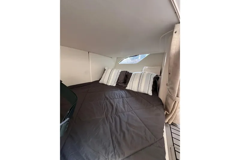 Slide: The Image of Cozy cabin interior of 2020 Intrepid 409 Valor with bed and pillows. - 48