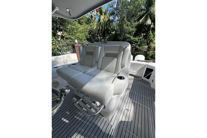 Slide: The Image of 2020 Intrepid 409 Valor boat interior with plush seating and sleek design. - 49