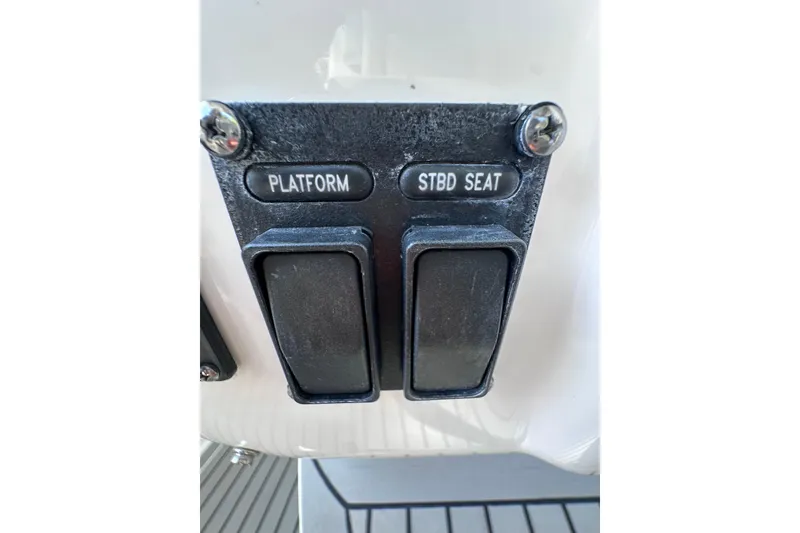 Slide: The Image of Control switches on a 2020 Intrepid 409 Valor boat dashboard. - 50