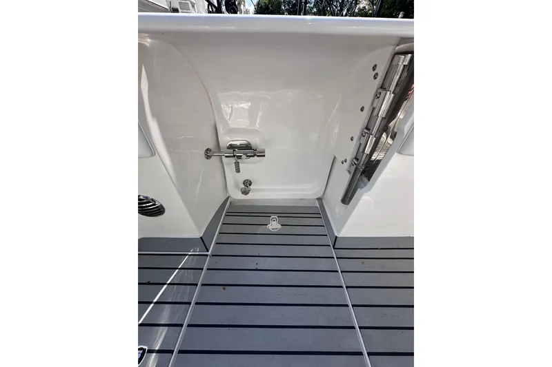 Slide: The Image of 2020 Intrepid 409 Valor boat interior with sleek, modern design and stainless steel fixtures. - 54