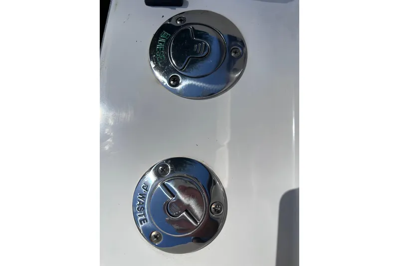 Slide: The Image of Fuel and waste caps on a 2020 Intrepid 409 Valor boat. - 60