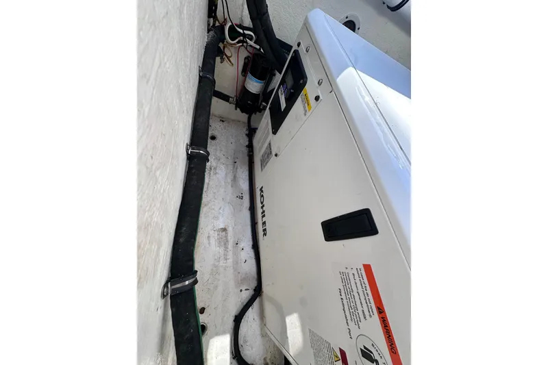 Slide: The Image of Engine compartment of 2020 Intrepid 409 Valor with Kohler generator and wiring. - 63