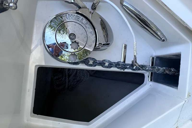 Slide: The Image of Anchor chain and winch on 2020 Intrepid 409 Valor boat deck. - 73