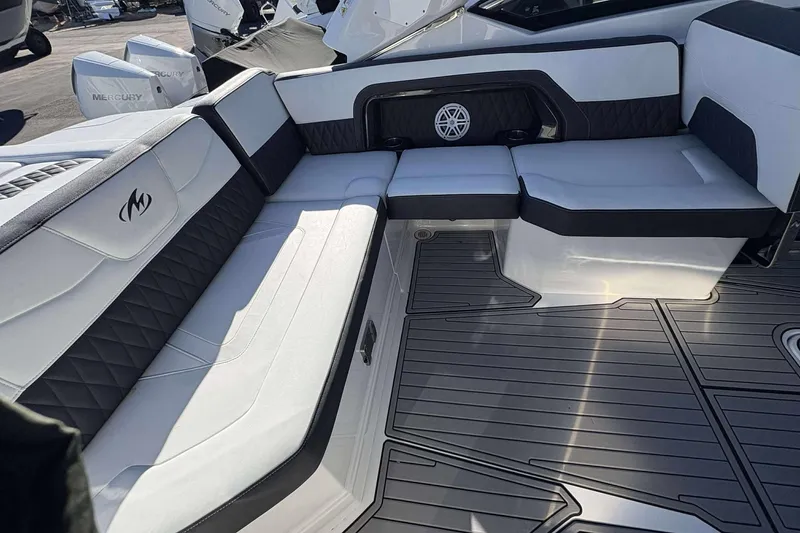 Slide: The Image of 2023 Monterey 305SS Super Sport boat interior with luxurious seating and modern design. - 11