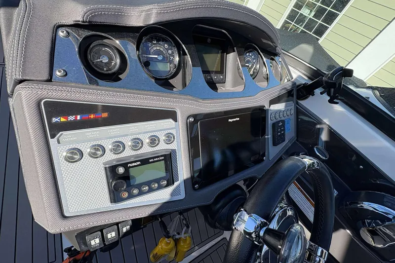Slide: The Image of Dashboard of 2023 Monterey 305SS Super Sport boat with advanced controls and gauges. - 16