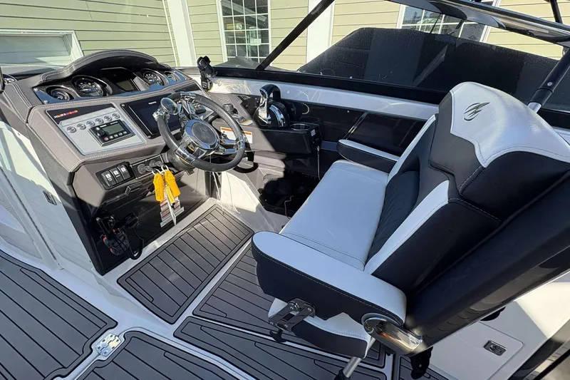 Slide: The Image of 2023 Monterey 305SS Super Sport boat cockpit with modern controls and seating. - 17