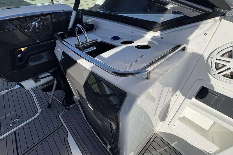 Slide: The Image of 2023 Monterey 305SS Super Sport boat interior with sleek design and modern amenities. - 18