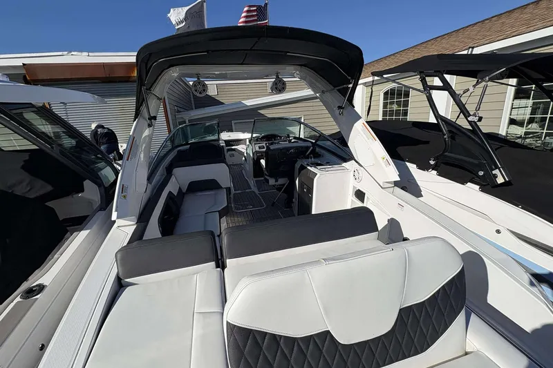 Slide: The Image of 2023 Monterey 305SS Super Sport boat interior with luxurious seating and modern design. - 22