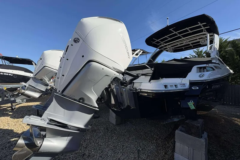 Slide: The Image of 2023 Monterey 305SS Super Sport boat with dual Mercury outboard engines, displayed outdoors. - 25