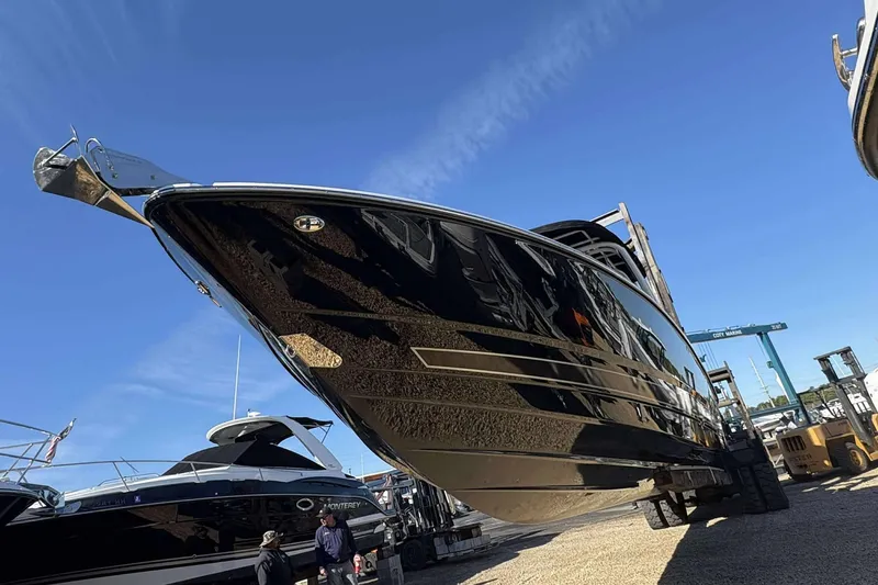 Slide: The Image of 2023 Monterey 305SS Super Sport boat in a marina, viewed from below. - 4
