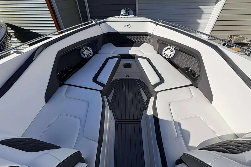 Slide: The Image of 2023 Monterey 305SS Super Sport boat interior with sleek white seating and modern design. - 9