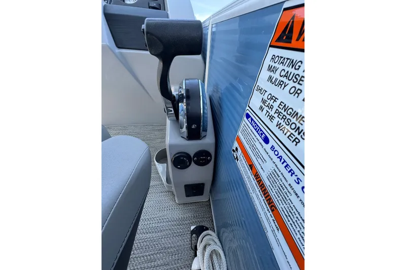 Slide: The Image of Throttle control and safety warnings on 2022 Bennington SX 23 Quad Bench boat. - 20