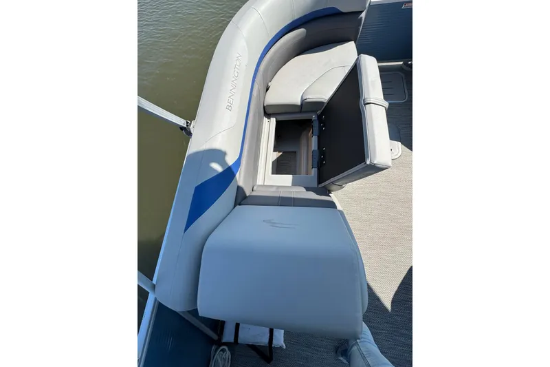Slide: The Image of 2022 Bennington SX 23 Quad Bench boat interior with open storage compartment. - 22