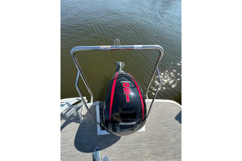 Slide: The Image of 2022 Bennington SX 23 Quad Bench with Mercury 150 outboard motor on water. - 29