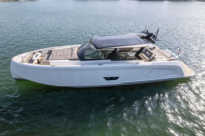 Slide: The Image of 2022 Vanquish Yachts VQ58 luxury yacht on calm water. - 16
