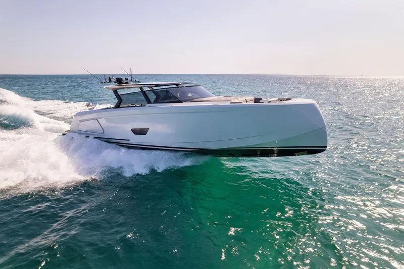 Slide: The Image of 2022 Vanquish Yachts VQ58 cruising on open sea under clear sky. - 26