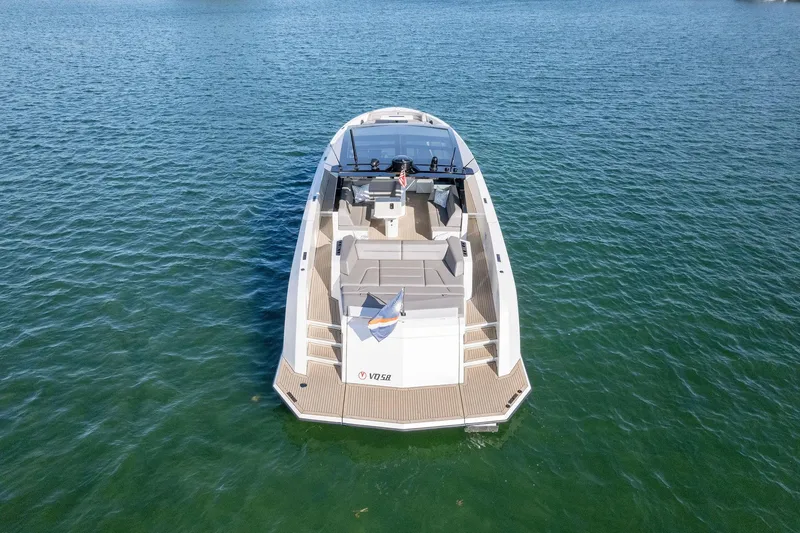 Slide: The Image of Vanquish Yachts VQ58 2022 model on calm water, aerial view. - 34