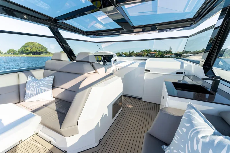 Slide: The Image of Luxurious interior of 2022 Vanquish Yachts VQ58 with sleek seating and panoramic views. - 43