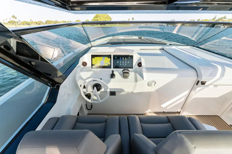 Slide: The Image of Modern helm of 2022 Vanquish Yachts VQ58 with sleek design and advanced navigation systems. - 44