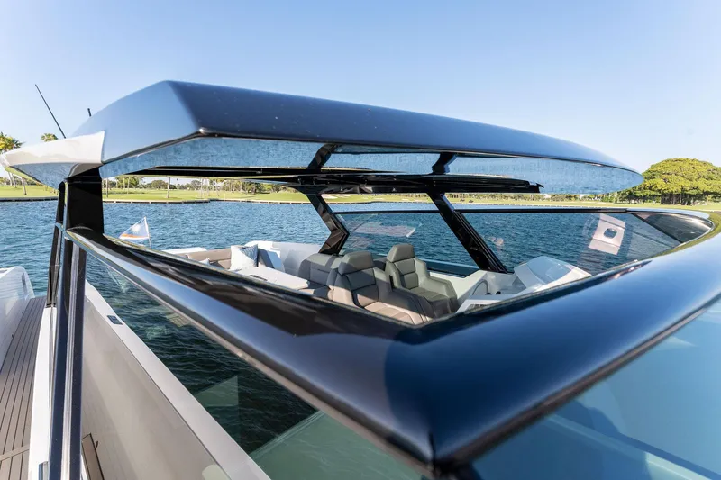 Slide: The Image of 2022 Vanquish Yachts VQ58 luxury yacht with sleek design on a sunny day. - 47